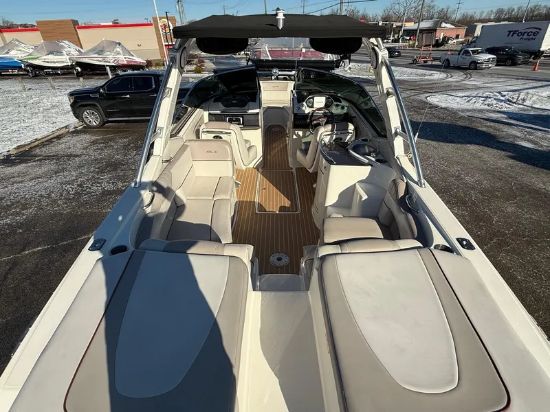 Slide: The Image of 2005 Sea Ray 270 SLX boat interior with spacious seating and modern design. - 5