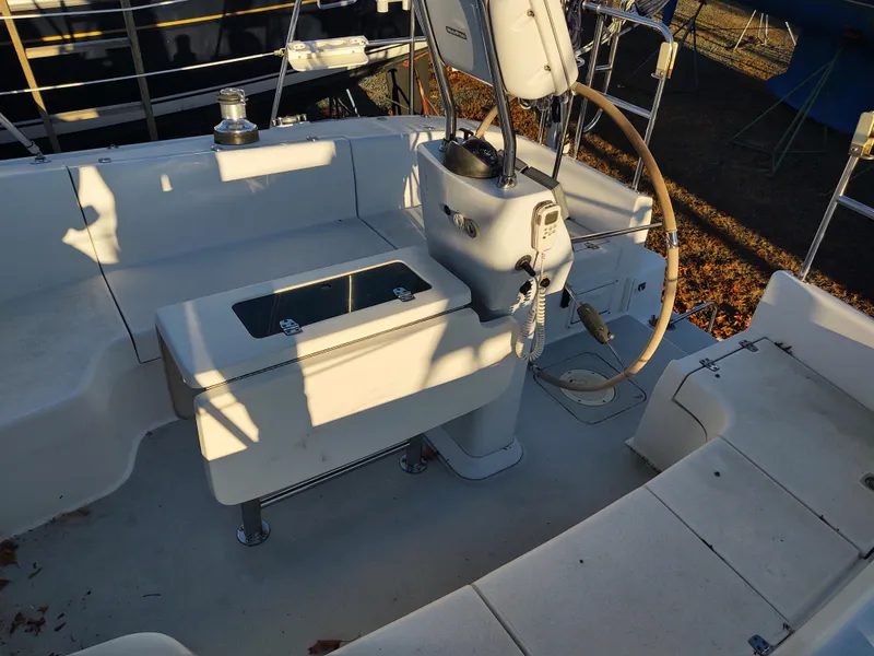 Slide: The Image of 2006 Catalina 350 MK II sailboat cockpit with steering wheel and seating area. - 16