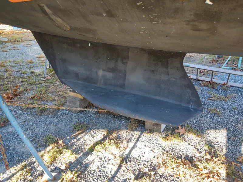 Slide: The Image of Catalina 350 MK II 2006 sailboat keel on gravel, side view. - 3