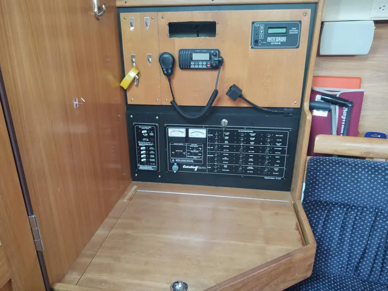 Slide: The Image of Catalina 350 MK II 2006 navigation panel with radio and control switches. - 33