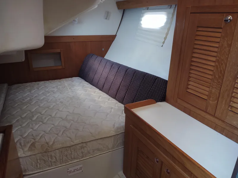 Slide: The Image of Interior cabin of 2006 Catalina 350 MK II sailboat with bed and wooden cabinetry. - 37