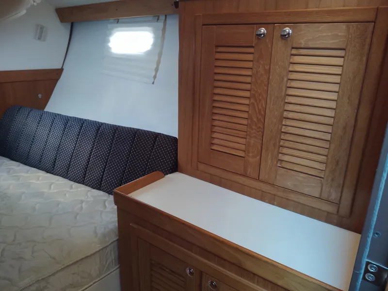 Slide: The Image of Interior of 2006 Catalina 350 MK II yacht with wooden cabinetry and bed. - 39