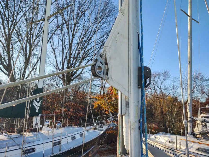 Slide: The Image of Catalina 350 MK II sailboat mast and rigging, 2006 model, docked with autumn trees in background. - 8