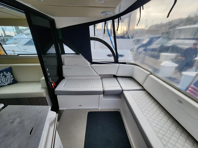 Slide: The Image of 2022 Regal 38 Grande Coupe interior with luxurious seating and modern design. - 14