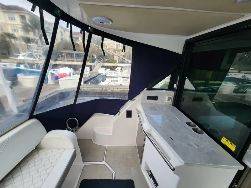 Slide: The Image of Interior of 2022 Regal 38 Grande Coupe yacht with seating and counter. - 15