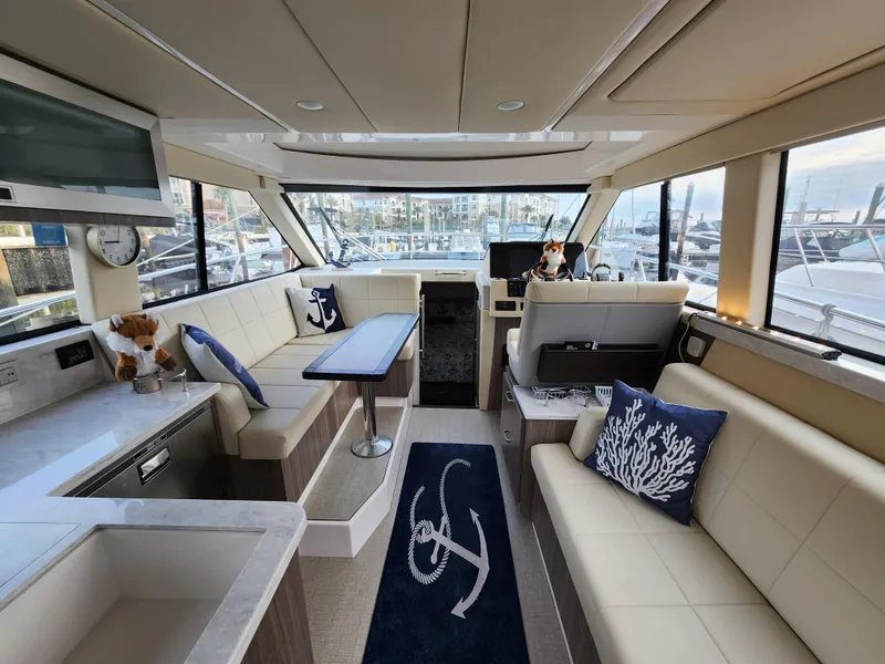 Slide: The Image of Luxurious interior of 2022 Regal 38 Grande Coupe yacht with elegant seating and nautical decor. - 17