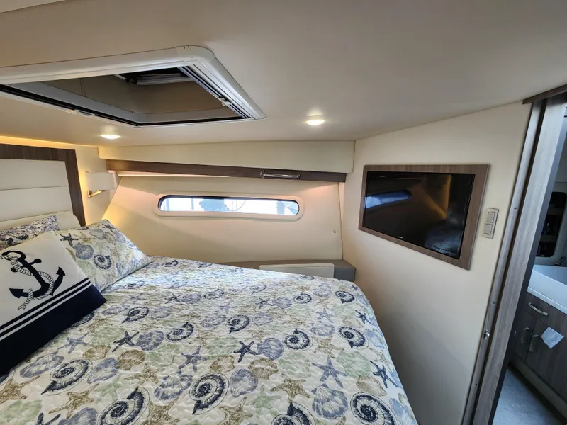 Slide: The Image of Luxurious bedroom interior of 2022 Regal 38 Grande Coupe yacht. - 27