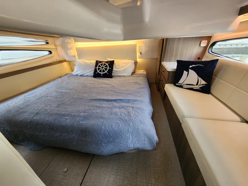 Slide: The Image of Luxurious cabin interior of 2022 Regal 38 Grande Coupe yacht with nautical decor. - 30