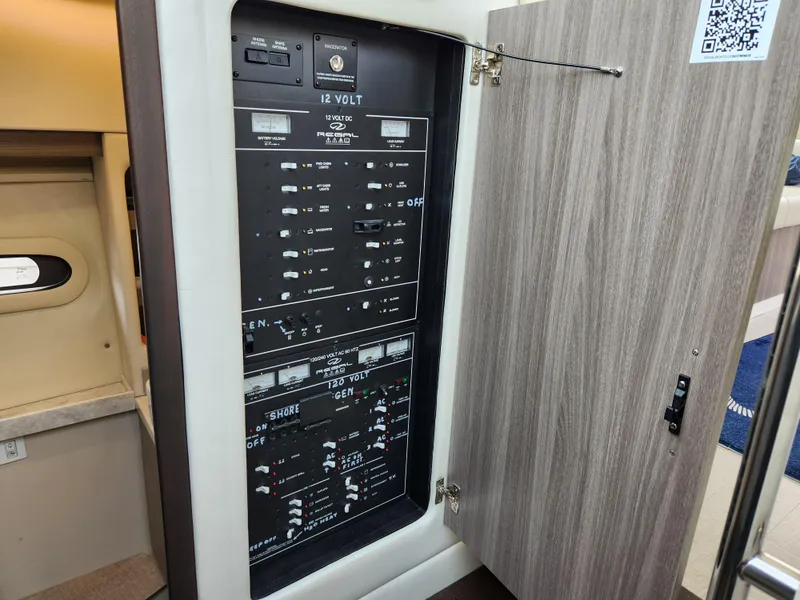 Slide: The Image of Electrical panel inside 2022 Regal 38 Grande Coupe yacht, showcasing control switches. - 35