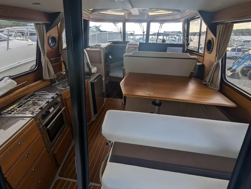 Slide: The Image of Interior of 2017 Ranger Tugs R-298 boat with kitchen and dining area. - 3