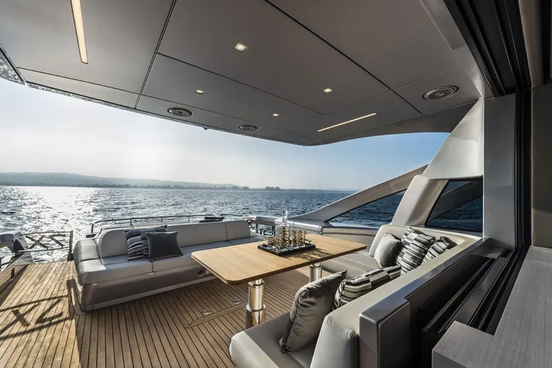 Slide: The Image of Luxurious 2026 Pershing 7X yacht deck with elegant seating and ocean view. - 10