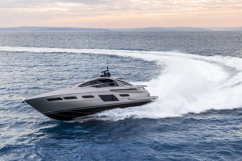 Slide: The Image of 2026 Pershing 7X yacht cruising swiftly on open sea under cloudy sky. - 14