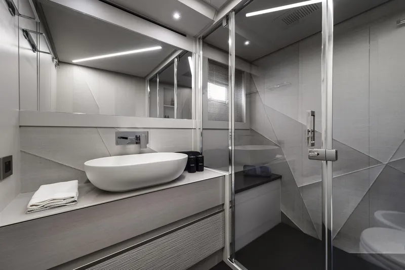 Slide: The Image of Modern bathroom in 2026 Pershing 7X yacht with sleek design and glass shower enclosure. - 23
