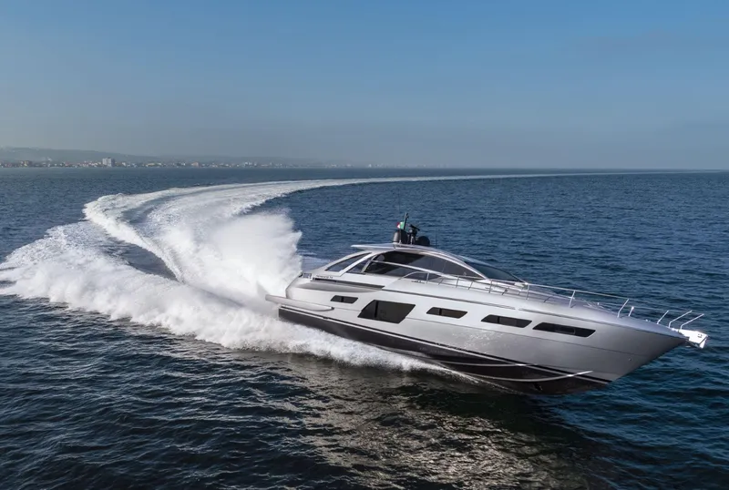 Slide: The Image of 2026 Pershing 7X yacht cruising swiftly on open sea under clear blue sky. - 4