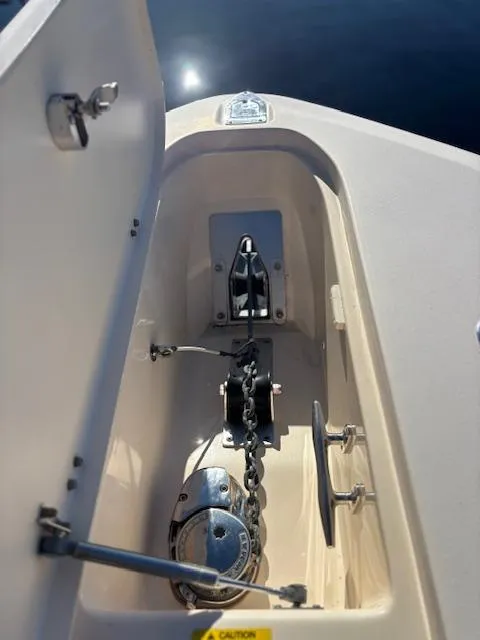 Slide: The Image of Anchor compartment of 2011 Grady-White Canyon 306 boat with chain and winch. - 11