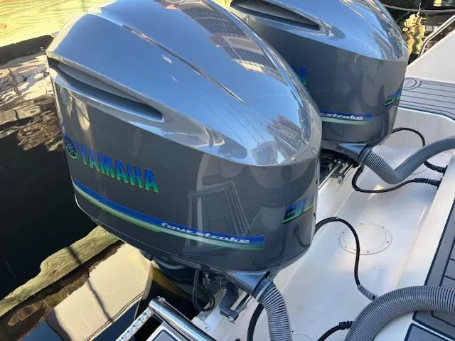 Slide: The Image of Twin Yamaha outboard engines on a 2011 Grady-White Canyon 306 boat. - 14