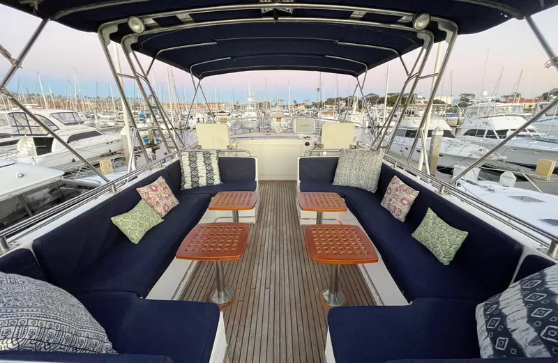 Slide: The Image of Spacious deck of 1995 Grand Banks 49 Motoryacht with comfortable seating and tables. - 13