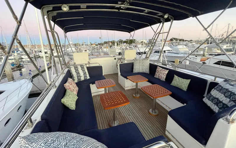 Slide: The Image of Spacious deck of 1995 Grand Banks 49 Motoryacht with comfortable seating and tables. - 14