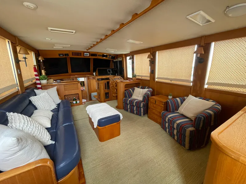 Slide: The Image of Luxurious interior of 1995 Grand Banks 49 Motoryacht with cozy seating and elegant wood finishes. - 20
