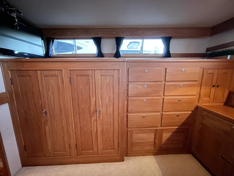 Slide: The Image of Wooden cabinetry in 1995 Grand Banks 49 Motoryacht interior, featuring ample storage and natural light. - 27