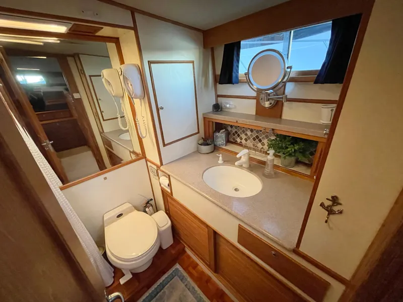 Slide: The Image of Bathroom interior of 1995 Grand Banks 49 Motoryacht with sink, toilet, and mirror. - 28
