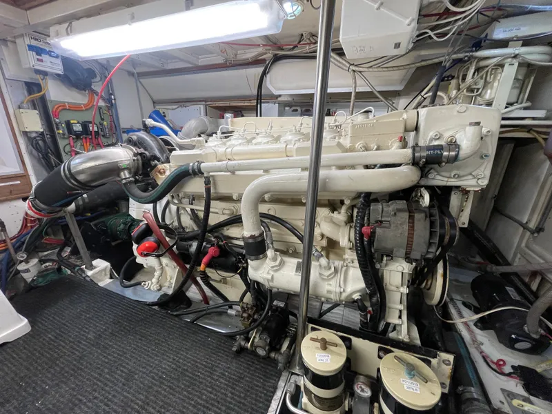 Slide: The Image of Engine room of 1995 Grand Banks 49 Motoryacht, showcasing detailed mechanical components. - 38