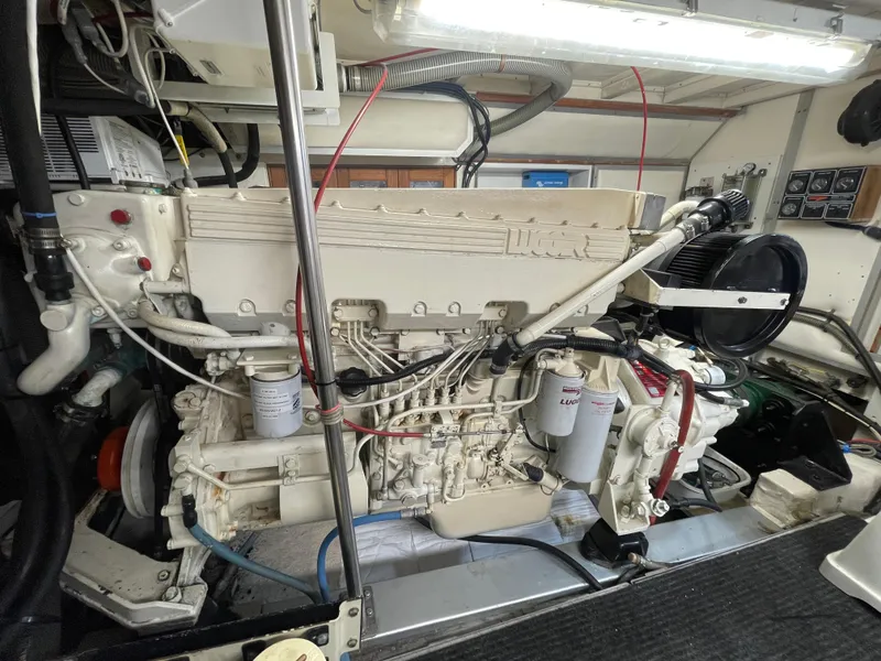 Slide: The Image of Engine room of a 1995 Grand Banks 49 Motoryacht, showcasing detailed machinery and components. - 39