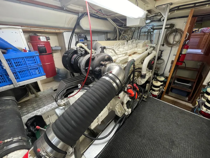 Slide: The Image of Engine room of 1995 Grand Banks 49 Motoryacht, showcasing mechanical components and equipment. - 41