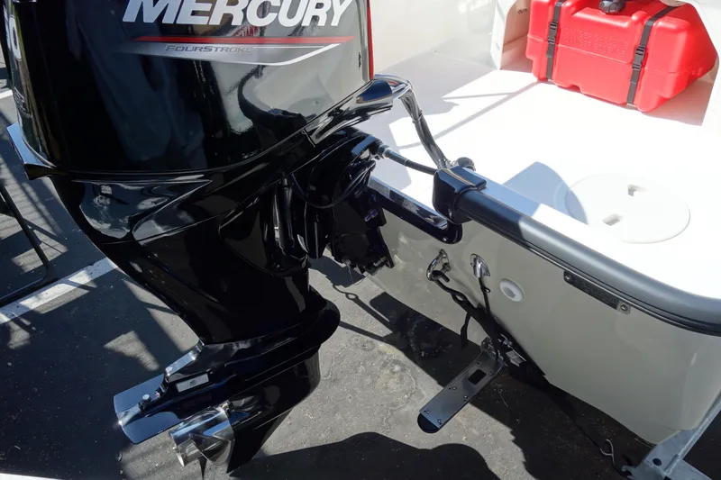 Slide: The Image of 2023 Boston Whaler 150 Montauk with Mercury outboard motor, rear view. - 18