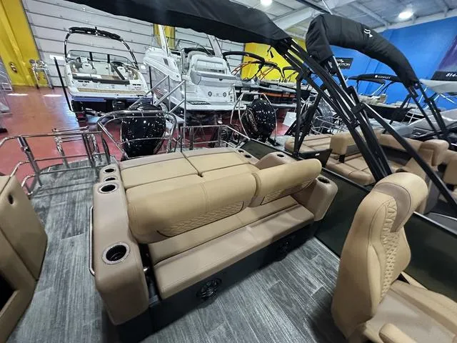 Slide: The Image of Luxurious 2025 Godfrey Pontoons Monaco 235 DFL interior with premium seating and modern dashboard. - 12