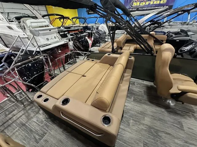 Slide: The Image of 2025 Godfrey Pontoons Monaco 235 DFL GTP interior with luxurious seating and modern dashboard. - 13