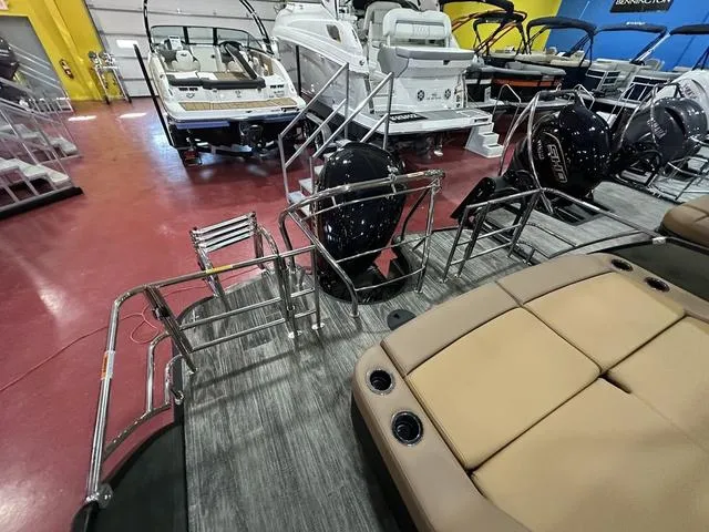 Slide: The Image of 2025 Godfrey Pontoons Monaco 235 DFL interior with tan seating and modern design. - 14