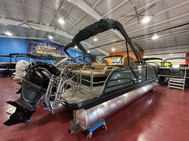 Slide: The Image of 2025 Godfrey Pontoons Monaco 235 DFL GTP interior with luxurious seating and modern dashboard. - 20