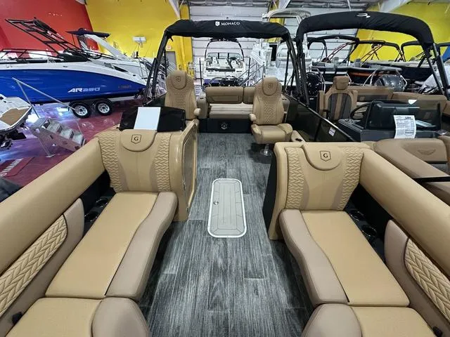Slide: The Image of 2025 Godfrey Pontoons Monaco 235 DFL GTP with luxurious seating and modern interior design. - 5