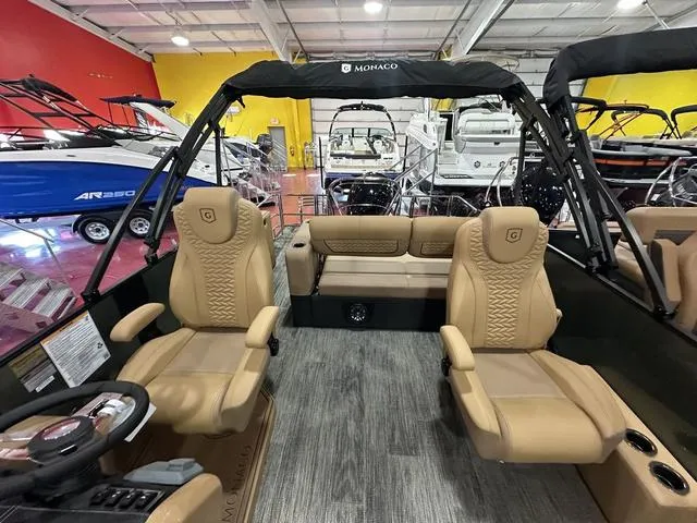 Slide: The Image of 2025 Godfrey Pontoons Monaco 235 DFL interior with tan seating and stainless steel railings. - 9