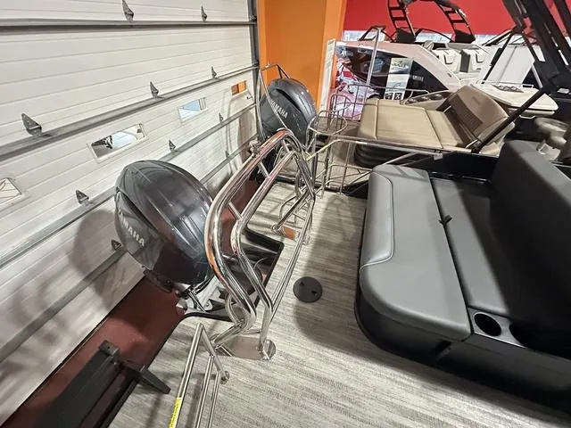 Slide: The Image of 2025 Godfrey Pontoons Sweetwater 2286 SFL GTP, luxury seating in showroom. - 13