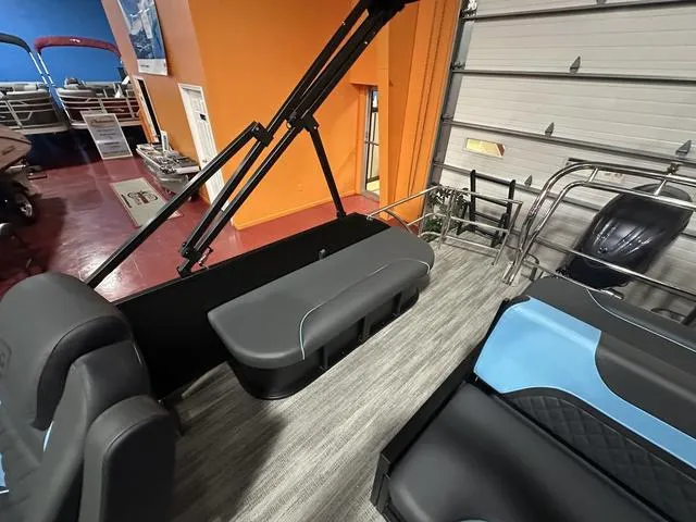 Slide: The Image of 2025 Godfrey Pontoons Sweetwater 2286 SFL interior seating with storage and cup holders. - 14