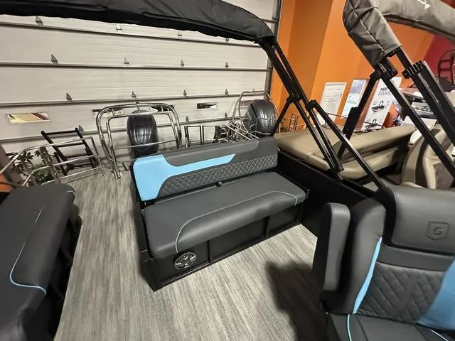 Slide: The Image of 2025 Godfrey Pontoons Sweetwater 2286 SFL interior with sleek seating and cup holders. - 16