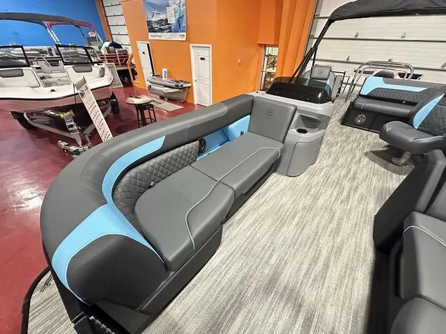 Slide: The Image of 2025 Godfrey Sweetwater 2286 SFL pontoon boat in workshop with Yamaha outboard motor. - 21