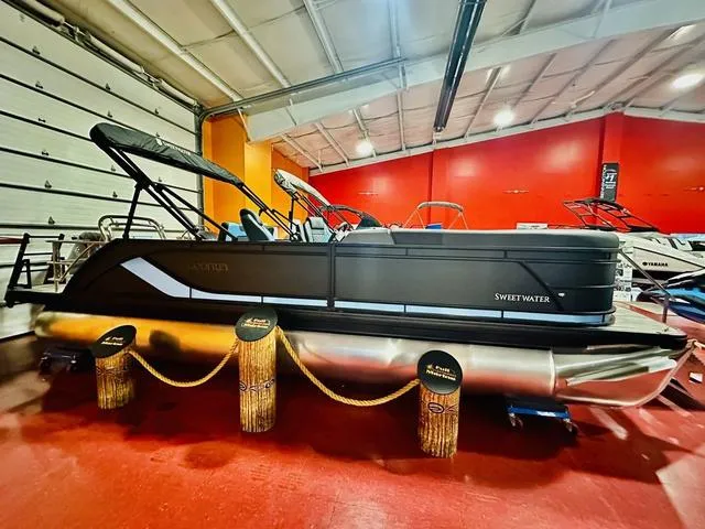 Slide: The Image of 2025 Godfrey Pontoons Sweetwater 2286 SFL GTP on trailer in indoor storage. - 3