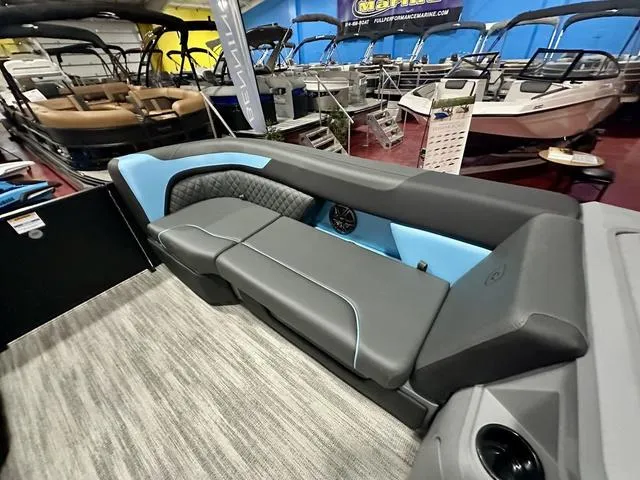 Slide: The Image of 2025 Godfrey Pontoons Sweetwater 2286 SFL interior seating with modern design and blue accents. - 5