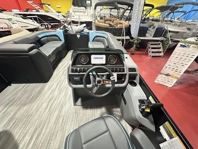 Slide: The Image of 2025 Godfrey Sweetwater 2286 SFL pontoon interior with modern seating and helm. - 7