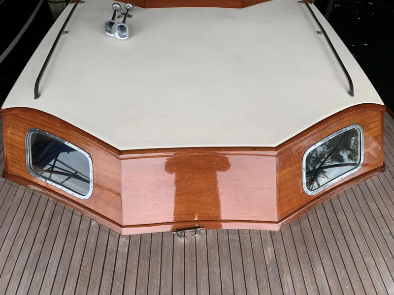 Slide: The Image of 1960 Prowler Semi-enclosed boat with wooden deck and cabin windows. - 10