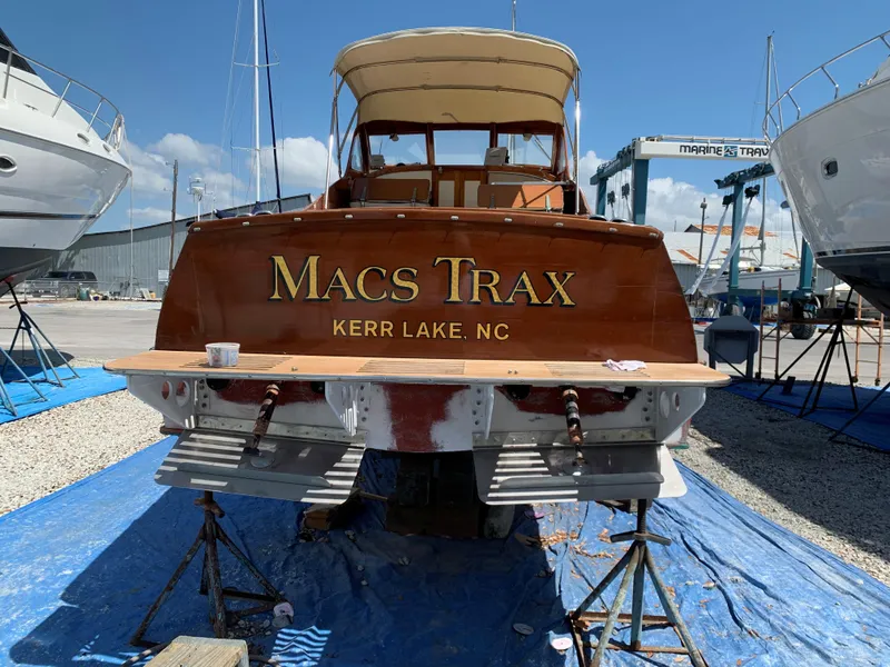 Slide: The Image of 1960 Prowler Semi-enclosed boat "Macs Trax" at Kerr Lake, NC, in a marina setting. - 19