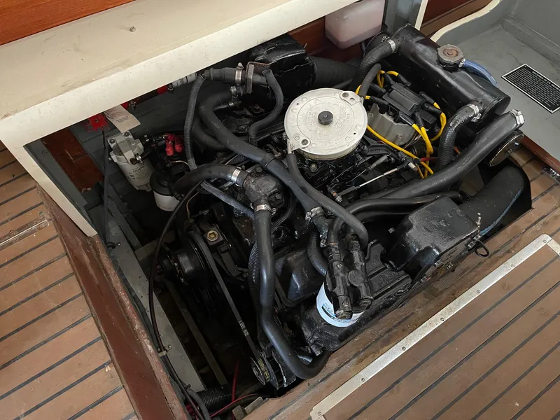 Slide: The Image of 1960 Prowler Semi-enclosed engine compartment with visible mechanical components and wiring. - 23