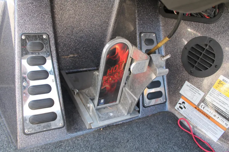 Slide: The Image of 2020 Ranger Z521L boat hot foot throttle pedal with warning labels. - 15