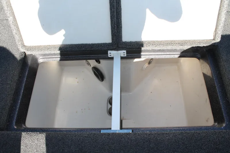 Slide: The Image of 2020 Ranger Z521L boat storage compartment, open and empty. - 16