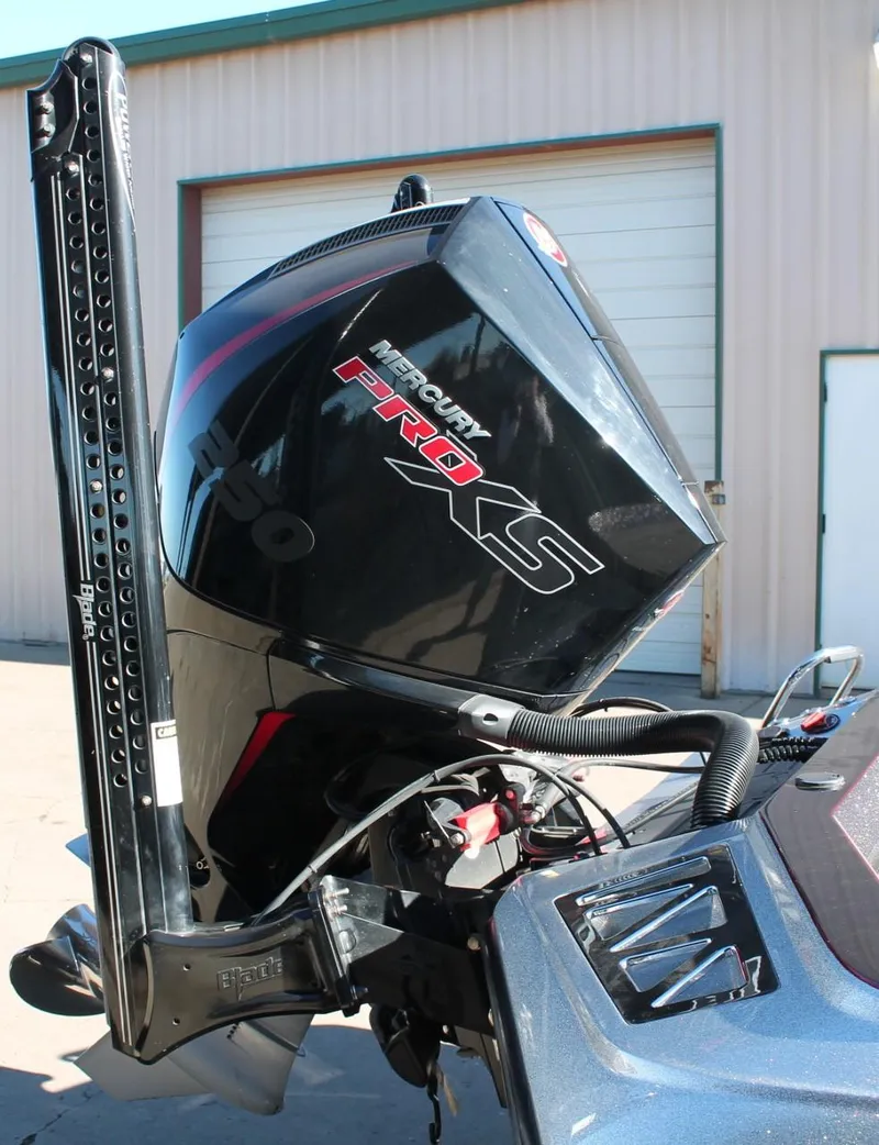 Slide: The Image of 2020 Ranger Z521L boat with Mercury Pro XS outboard motor in a garage setting. - 20