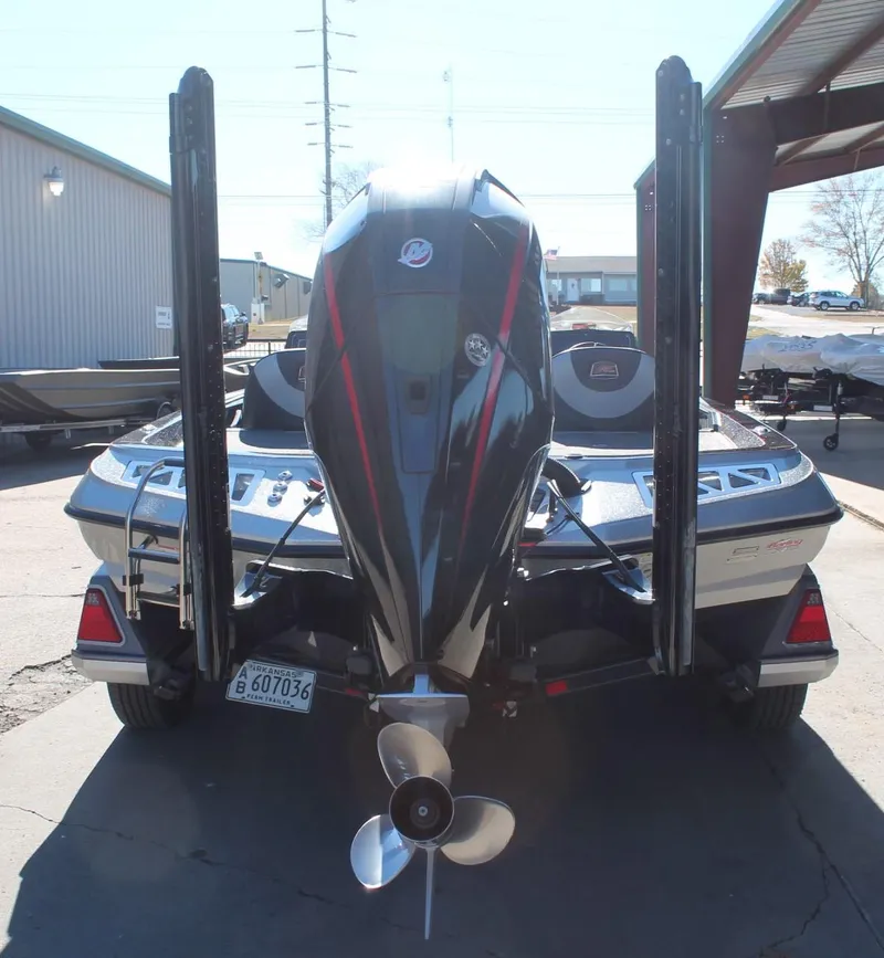 Slide: The Image of 2020 Ranger Z521L boat with powerful outboard motor, parked outdoors. - 23