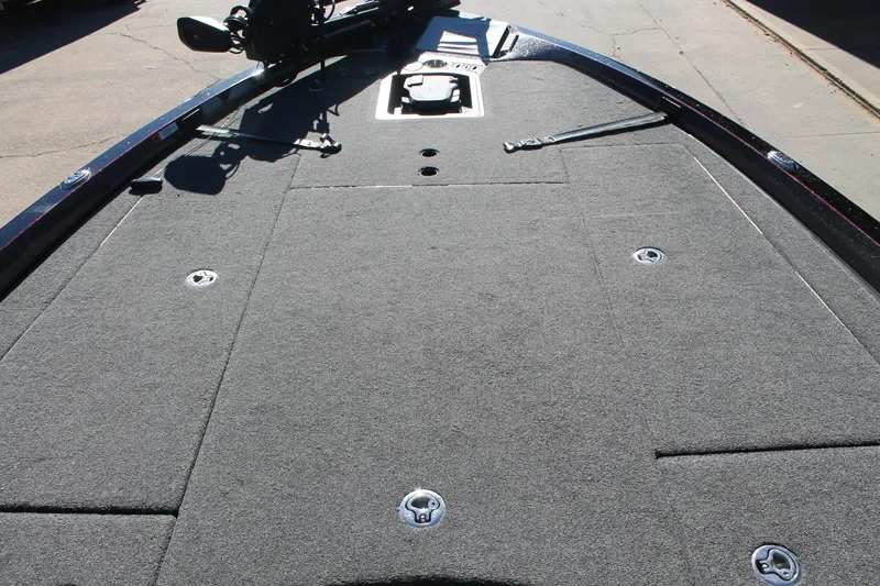 Slide: The Image of 2020 Ranger Z521L boat deck with carpeted surface and storage compartments. - 28